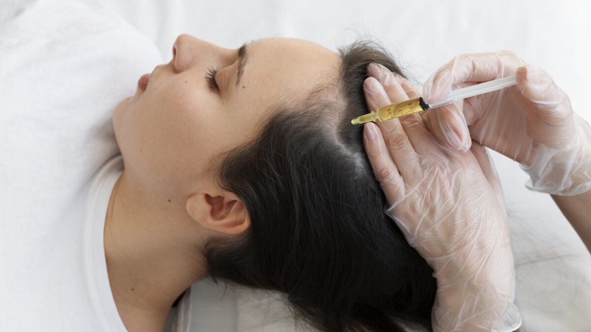 A dermatologist in Mumbai performing PRP treatment for hair loss, highlighting the clinical setting and patient care.