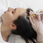 A dermatologist in Mumbai performing PRP treatment for hair loss, highlighting the clinical setting and patient care.